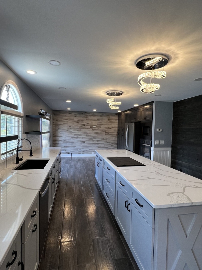 2472 Worthington Drive Aurora, IL 60506 - Photo 3 of 26 a large kitchen with stainless steel appliances a large counter top a stove a sink and a refrigerator