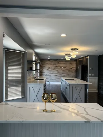 a kitchen with a sink cabinets and window