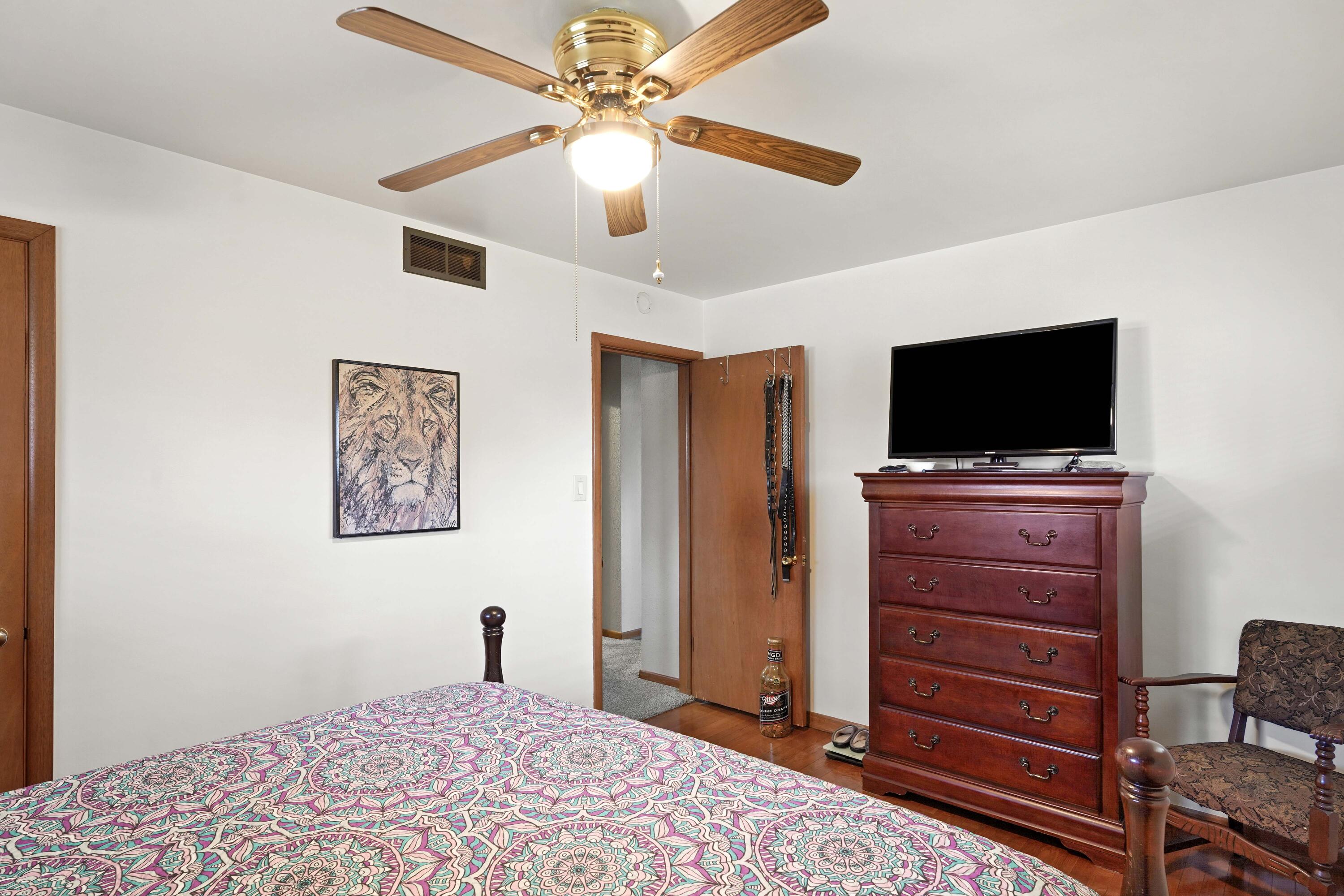 4900 Arthur Street Gary, IN 46408 - Photo 15 of 21 a bedroom with a bed and a flat screen tv