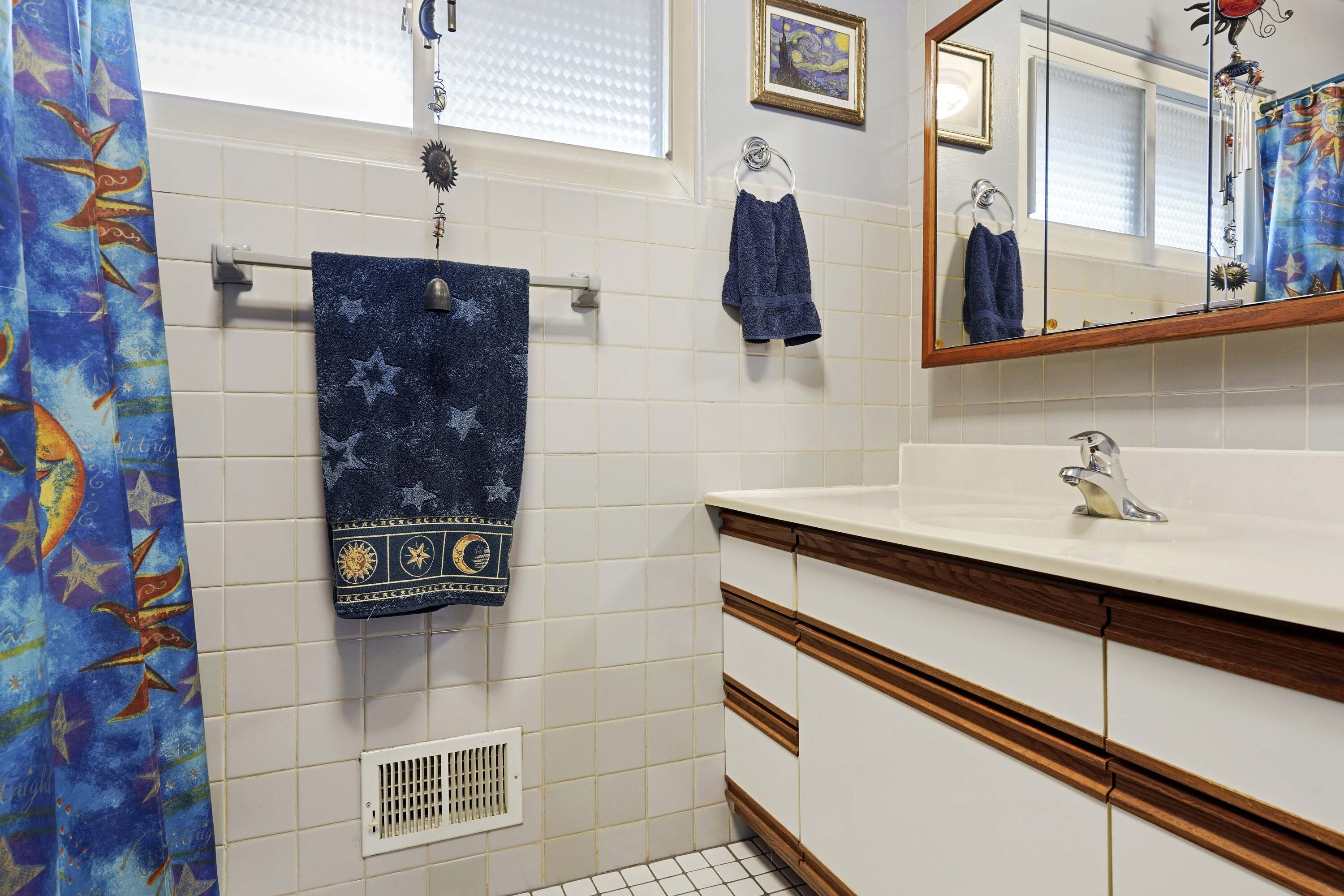 4900 Arthur Street Gary, IN 46408 - Photo 16 of 21 a bathroom with a sink and a mirror