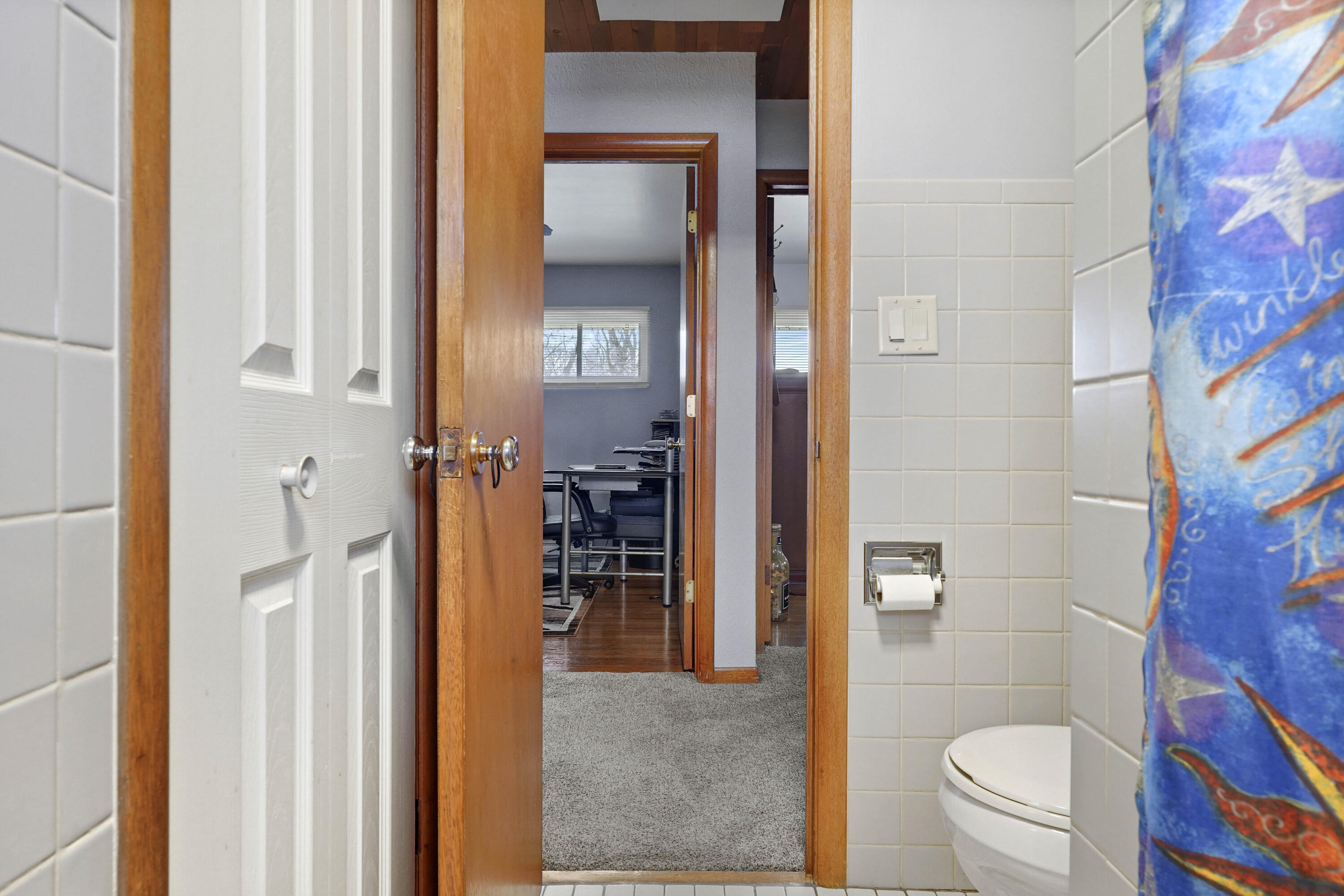 4900 Arthur Street Gary, IN 46408 - Photo 17 of 21 a bathroom with a toilet and a shower curtain