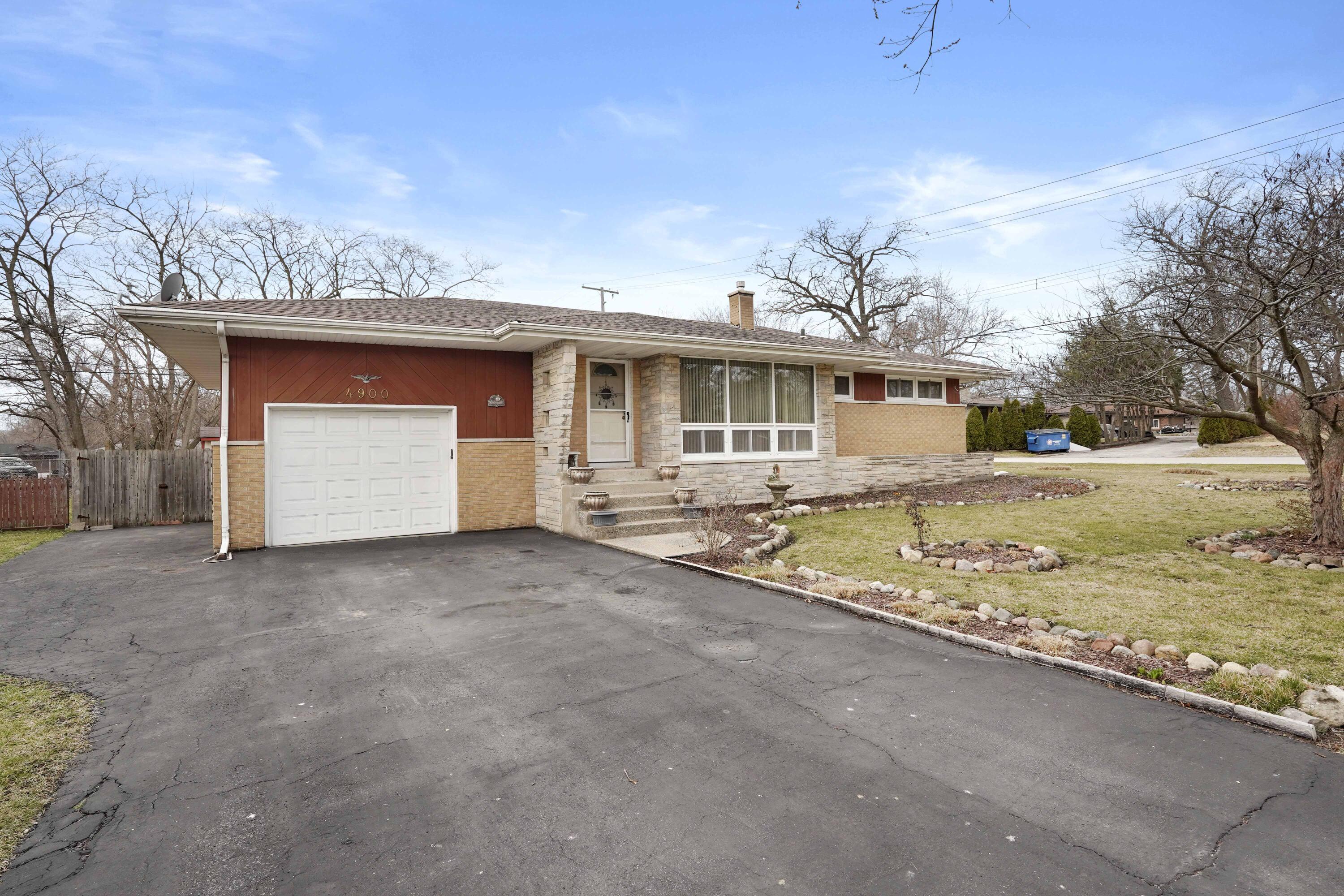 4900 Arthur Street Gary, IN 46408 - Photo 21 of 21 a view of a house with a yard and garage