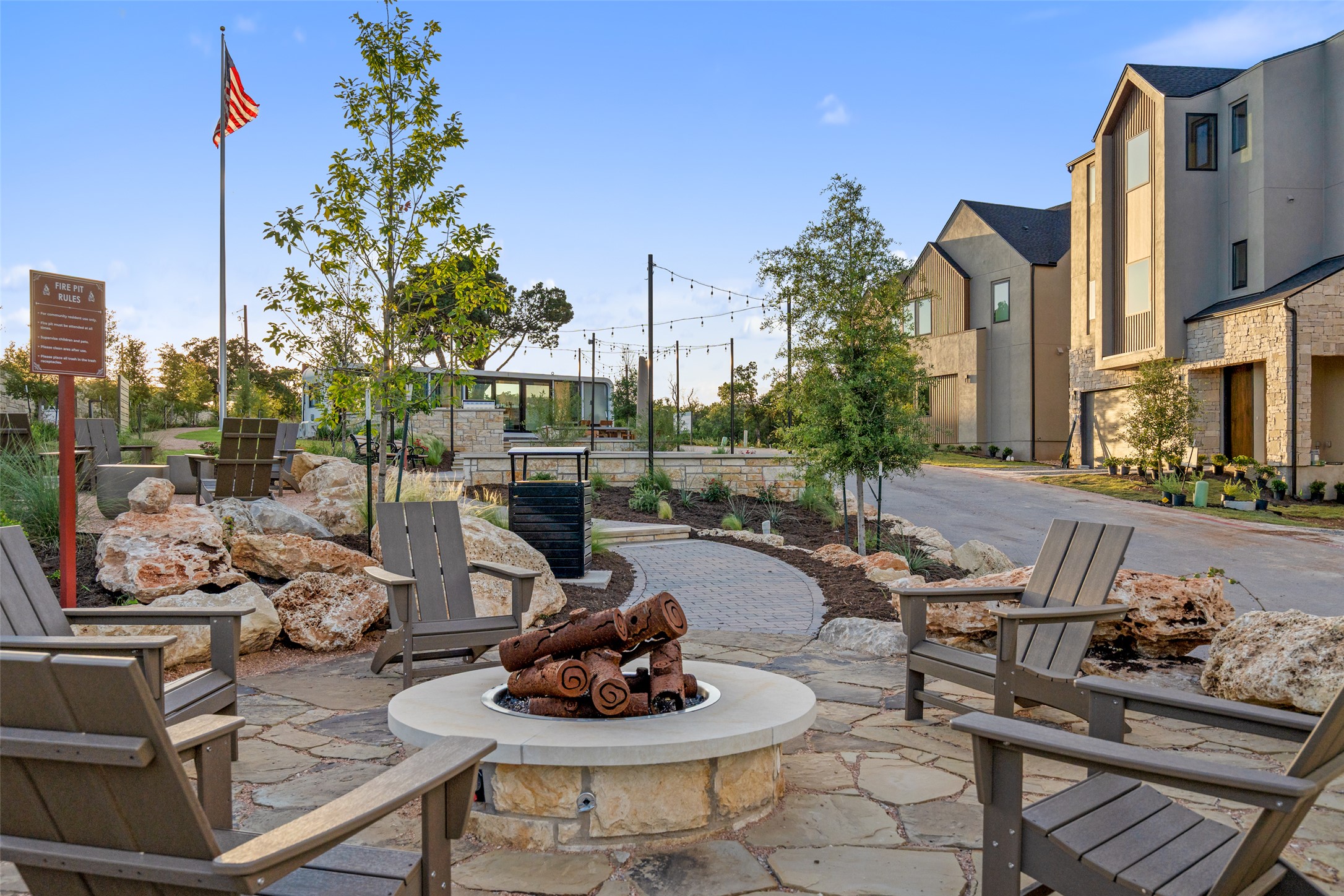 9803 Ribelin Ranch Court, Unit 6 Austin, TX 78750 - Photo 28 of 31 An inviting stone fire pit area beckons with Adirondack chairs, perfect for evening gatherings.