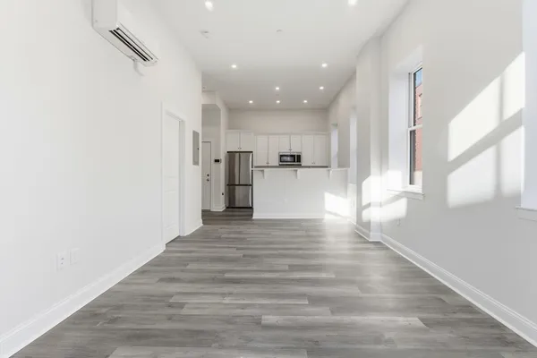 a kitchen with appliances a sink and a counter top space