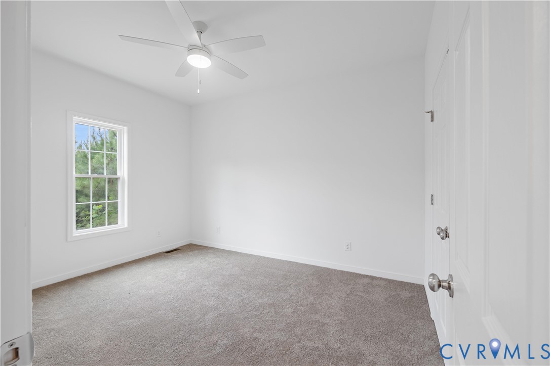 178 Barter Hill Road Cumberland, VA 23040 - Photo 20 of 34 Bedroom with light carpet and a ceiling fan