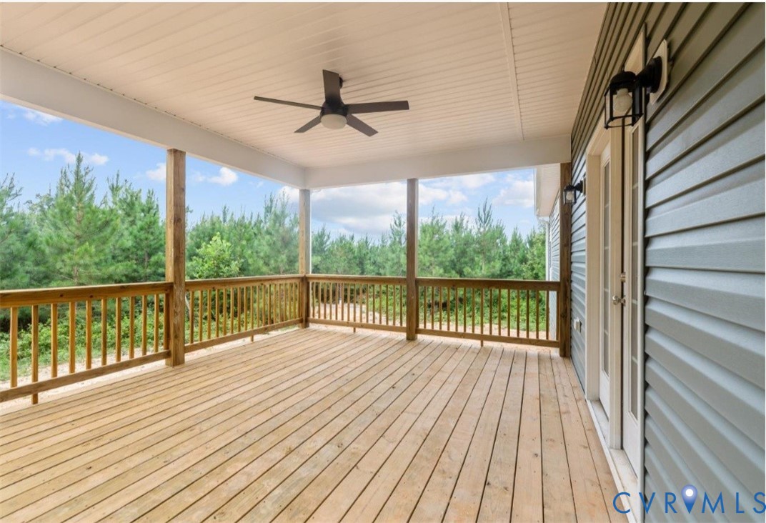 178 Barter Hill Road Cumberland, VA 23040 - Photo 6 of 34 Deck with a ceiling fan and view of wooded area