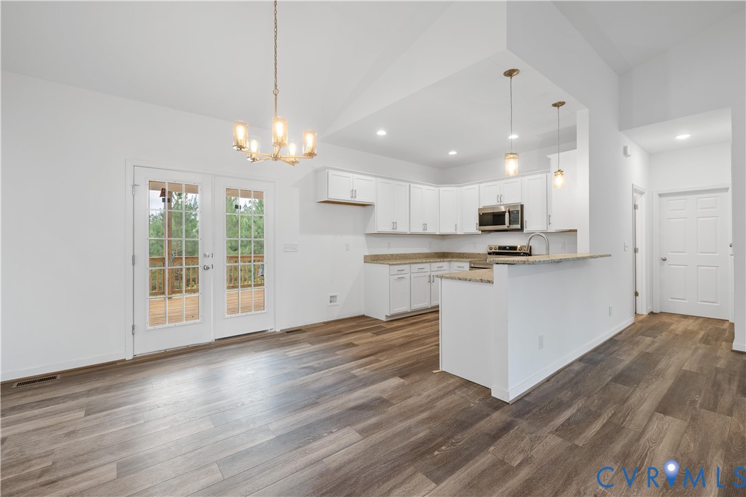 178 Barter Hill Road Cumberland, VA 23040 - Photo 8 of 34 Kitchen featuring white cabinetry, a peninsula, ha