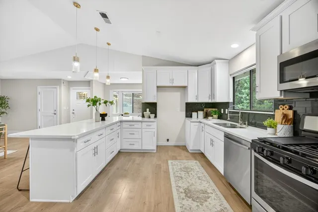 a view of a dining room with furniture and window