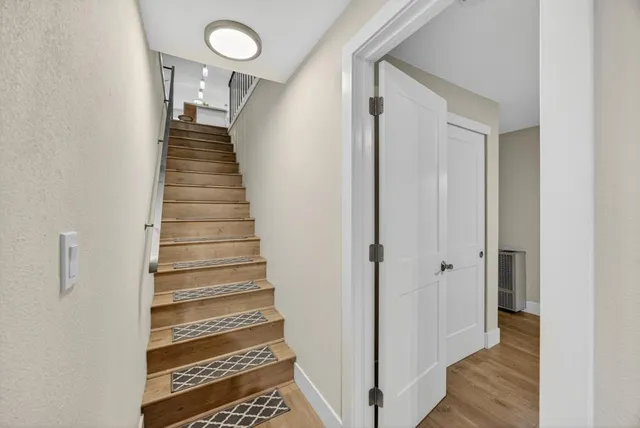 an empty room with windows and closet