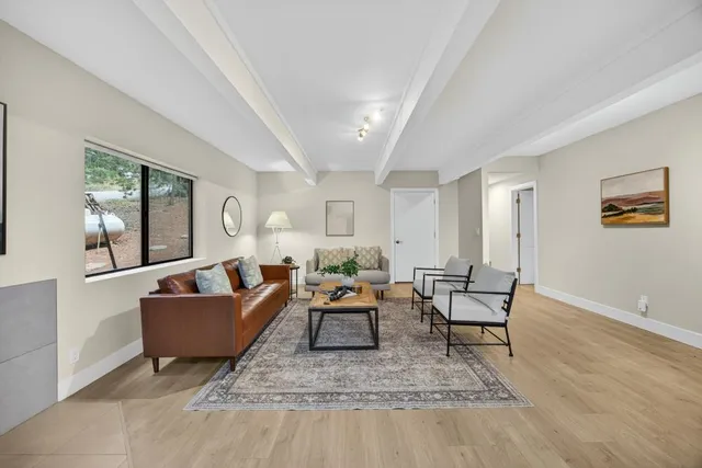a view of balcony with wooden floor and fence