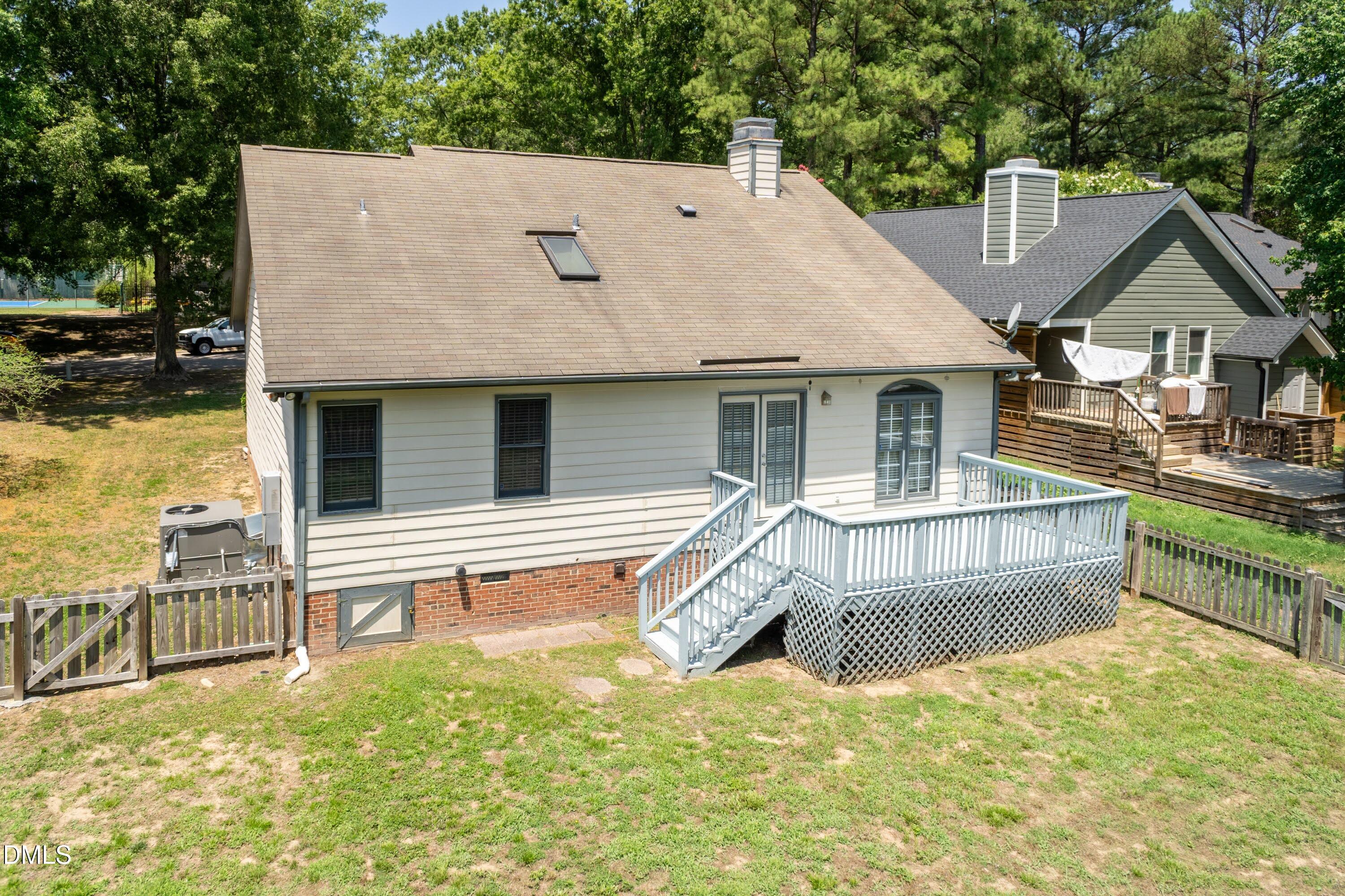 5604 Spring Pines Way Raleigh, NC 27616 - Photo 18 of 22 a view of house with backyard and trees in the background