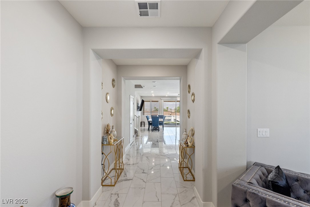 5592 Hickory Tree Street Las Vegas, NV 89149 - Photo 24 of 87 Hallway with light marble finish flooring and baseboards
