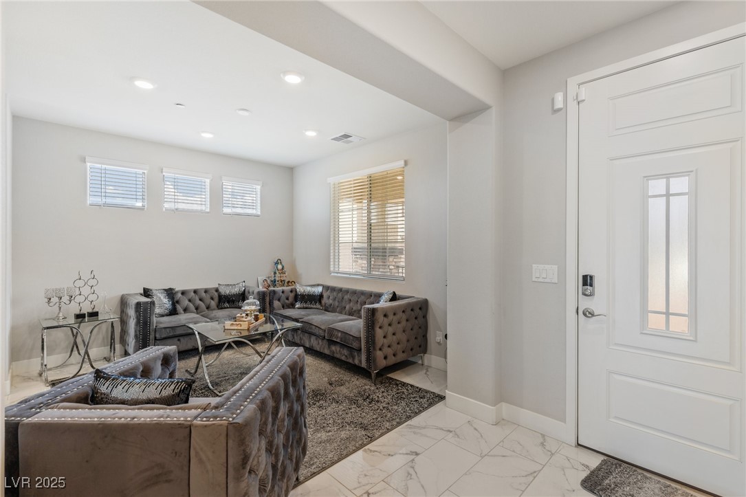 5592 Hickory Tree Street Las Vegas, NV 89149 - Photo 26 of 87 Entryway featuring light marble finish floors, healthy amount of natural light, and recessed lighting