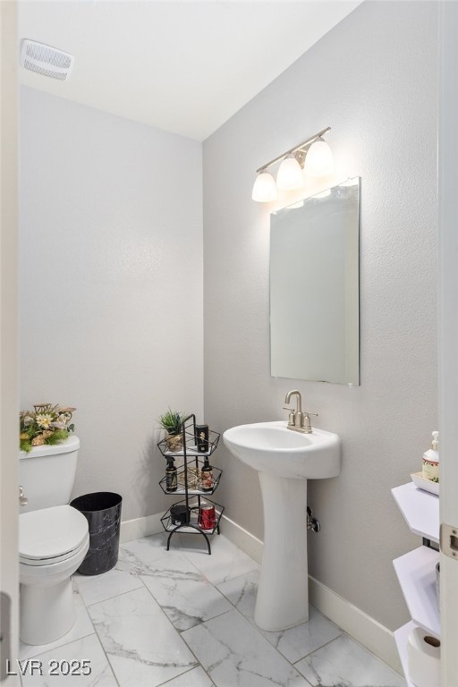 5592 Hickory Tree Street Las Vegas, NV 89149 - Photo 35 of 87 Bathroom featuring toilet and light marble finish flooring
