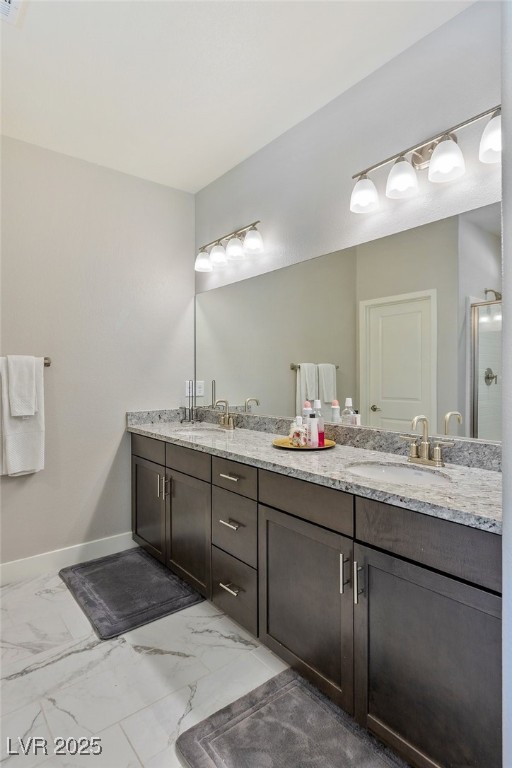 5592 Hickory Tree Street Las Vegas, NV 89149 - Photo 39 of 87 Bathroom with light marble finish flooring and double vanity