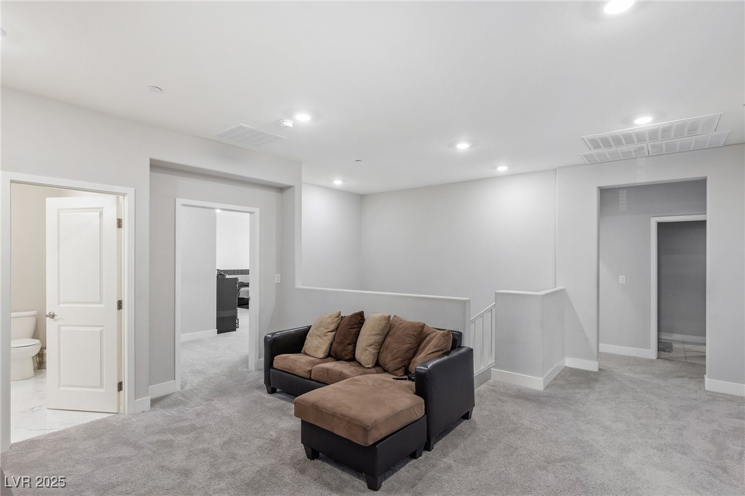 5592 Hickory Tree Street Las Vegas, NV 89149 - Photo 44 of 87 Living area featuring recessed lighting and light carpet