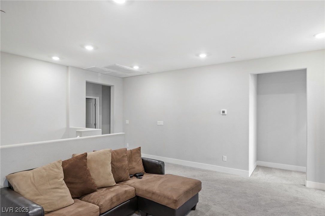 5592 Hickory Tree Street Las Vegas, NV 89149 - Photo 45 of 87 Living room featuring carpet floors and recessed lighting
