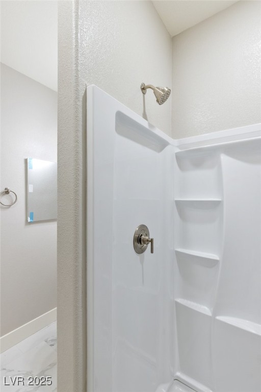 5592 Hickory Tree Street Las Vegas, NV 89149 - Photo 57 of 87 Full bath featuring a shower stall, light marble finish floors, and a textured wall