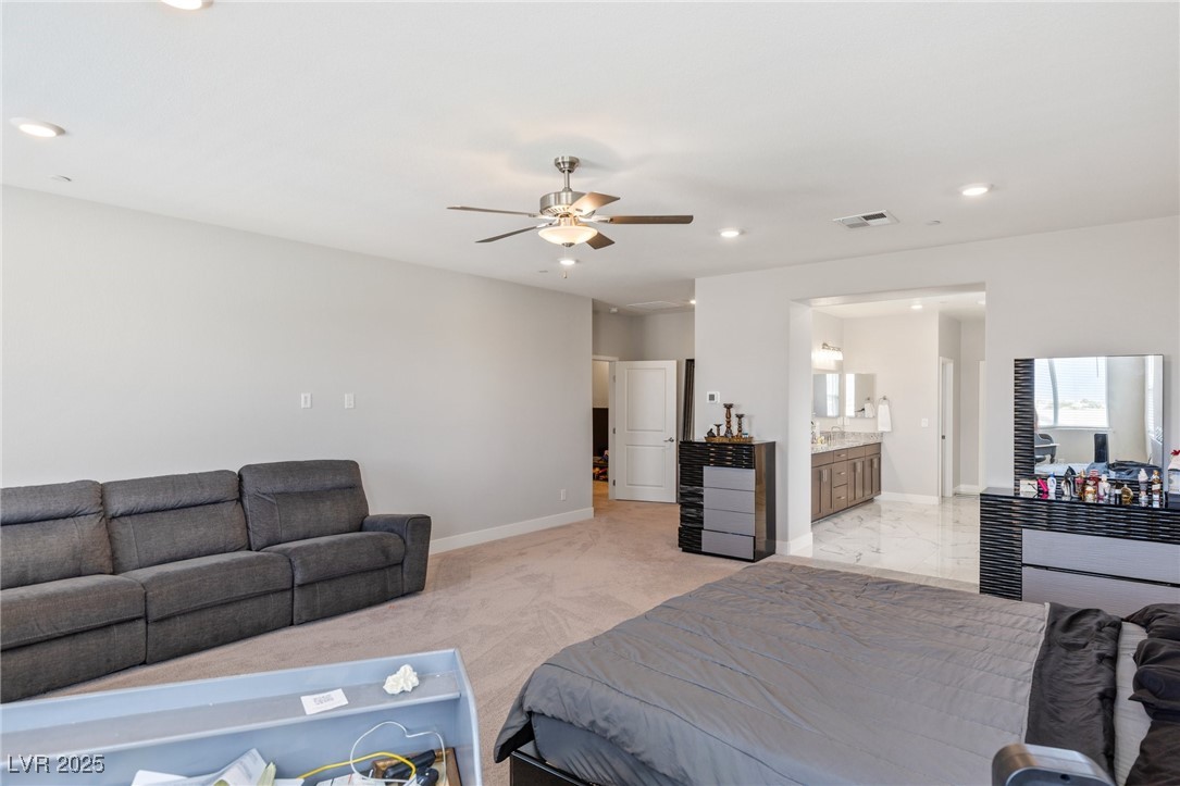 5592 Hickory Tree Street Las Vegas, NV 89149 - Photo 61 of 87 Bedroom featuring recessed lighting, light carpet, a ceiling fan, and ensuite bath