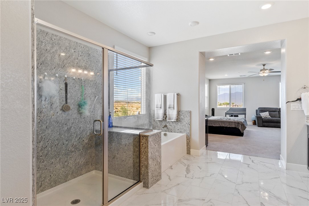 5592 Hickory Tree Street Las Vegas, NV 89149 - Photo 65 of 87 Full bath featuring ensuite bathroom, a garden tub, light marble finish flooring, a marble finish shower, and recessed lighting