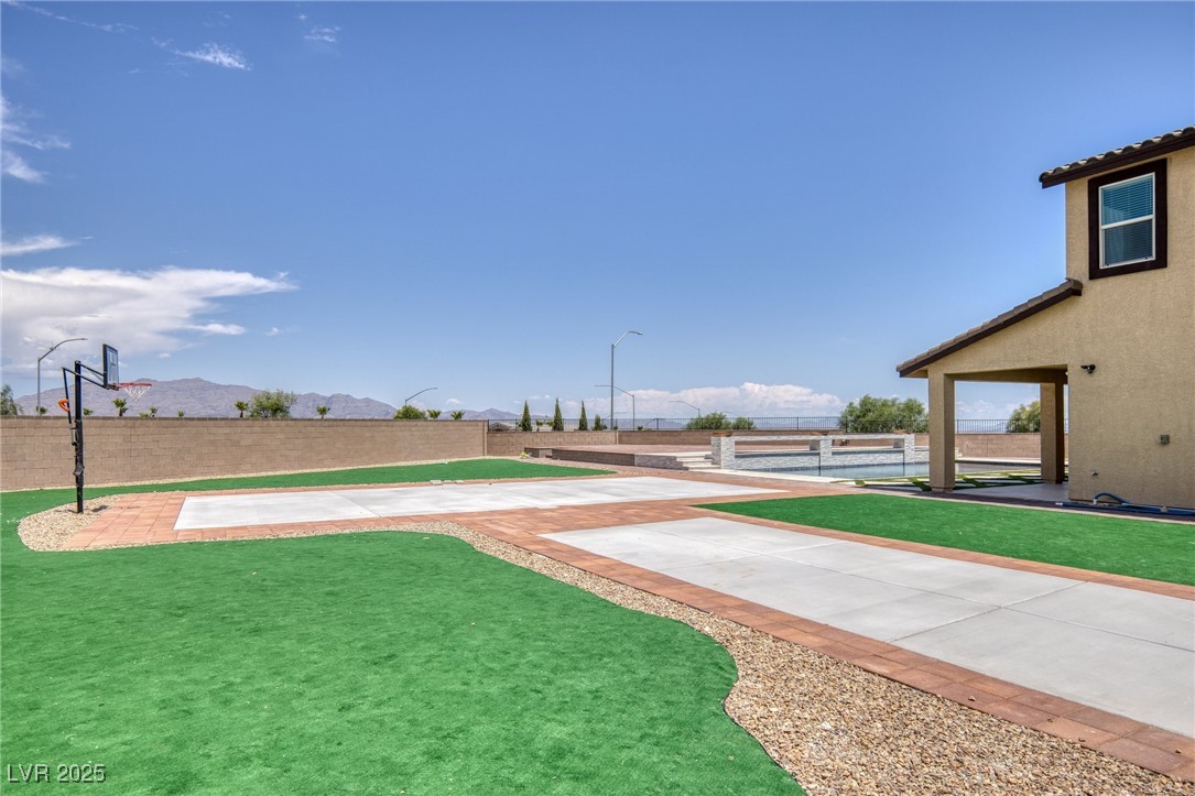5592 Hickory Tree Street Las Vegas, NV 89149 - Photo 74 of 87 Fenced yard featuring a patio area and a mountain view
