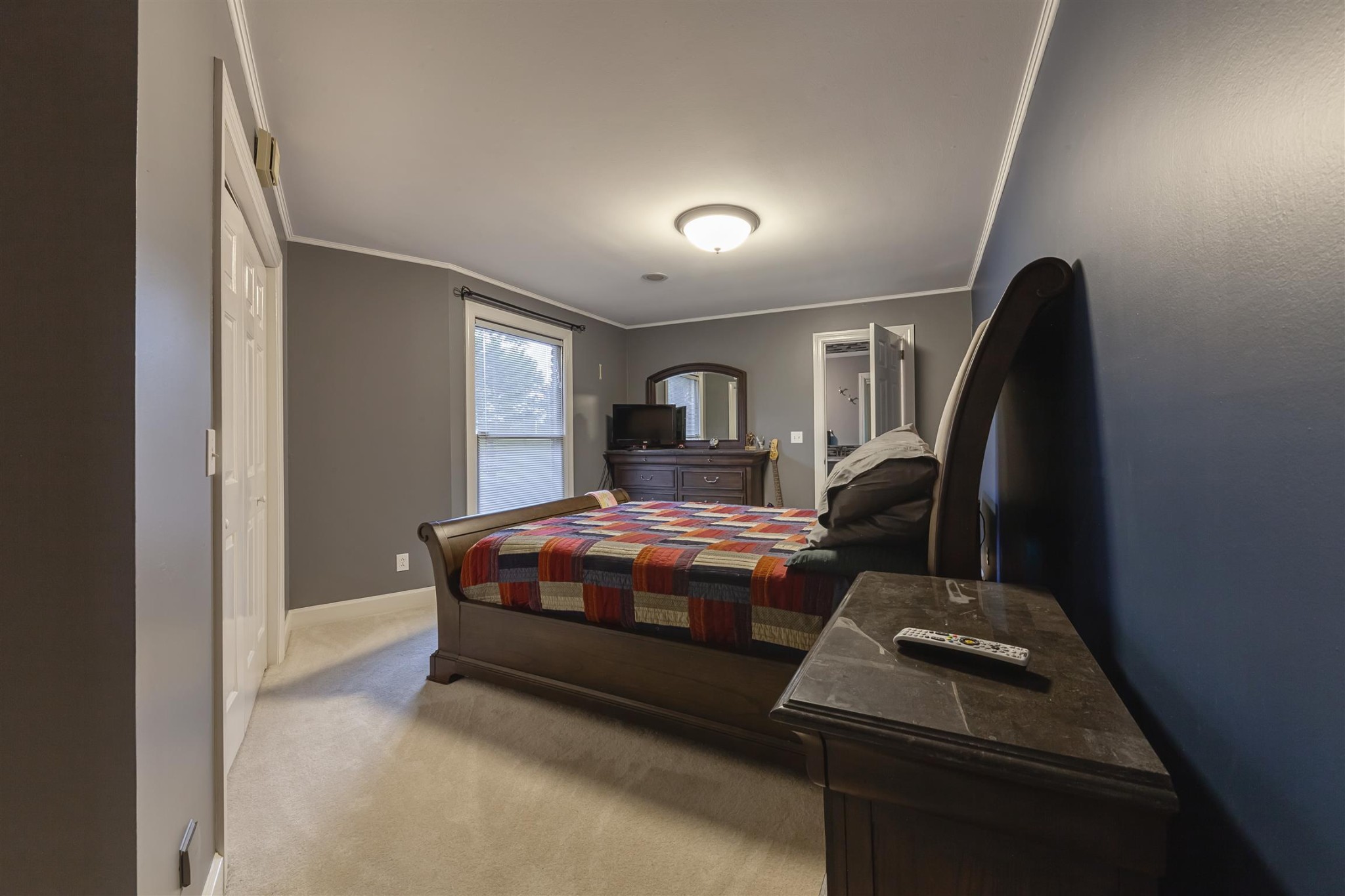 2732 Jack Teasley Road Pleasant View, TN 37146 - Photo 16 of 31 a bedroom with a bed next to a window