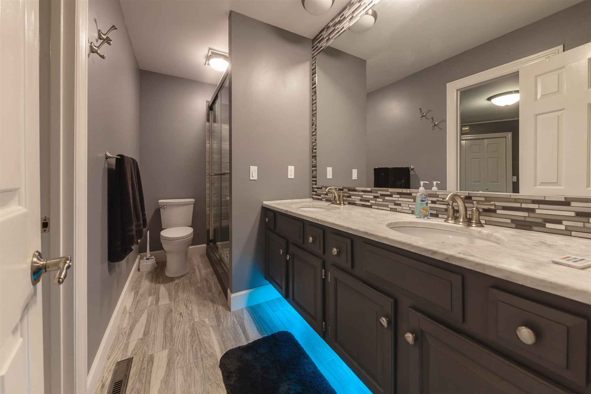 2732 Jack Teasley Road Pleasant View, TN 37146 - Photo 17 of 31 a spacious bathroom with a double vanity sink a mirror and a shower