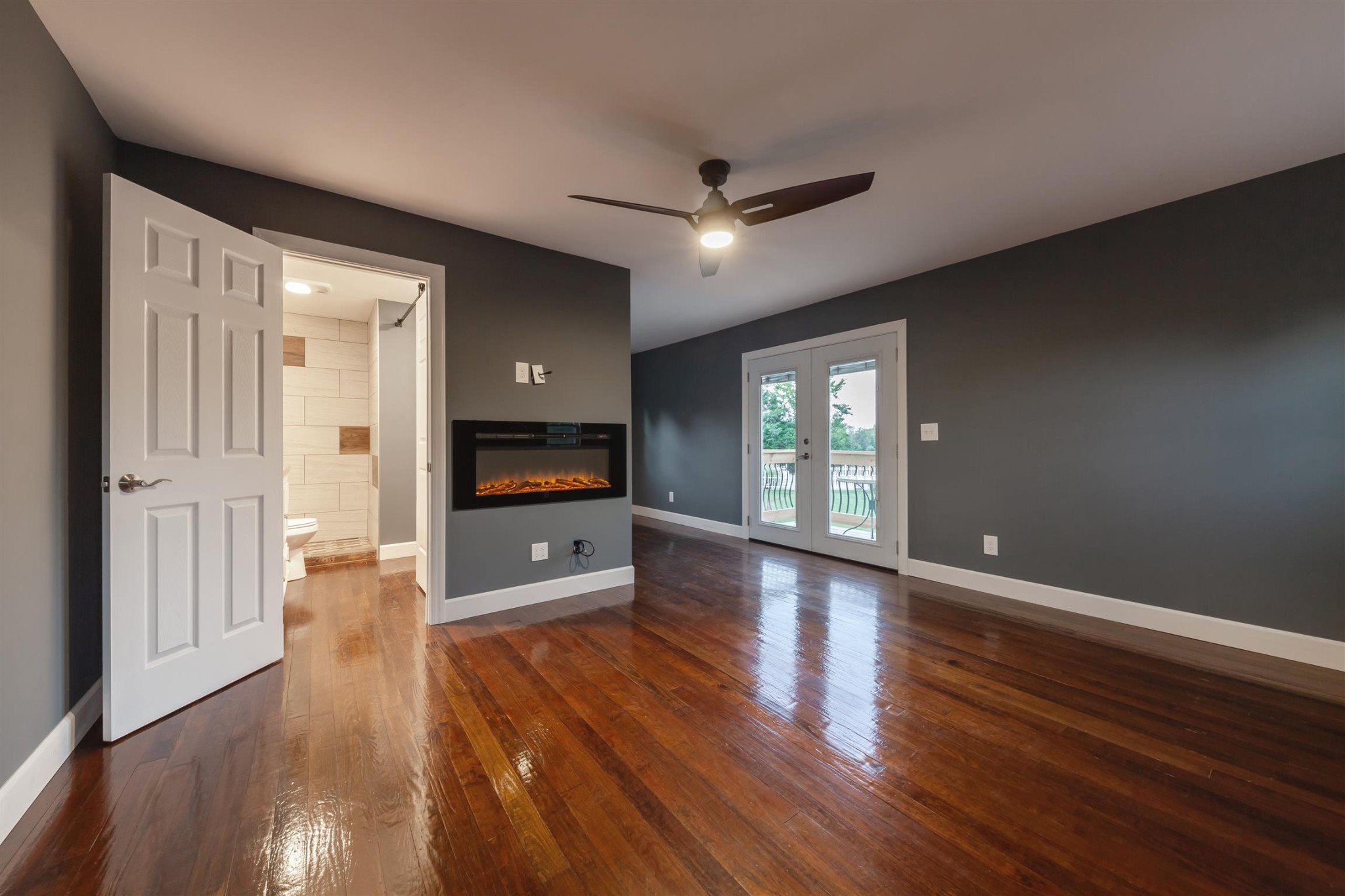 2732 Jack Teasley Road Pleasant View, TN 37146 - Photo 20 of 31 a view of a big room with wooden floor and windows