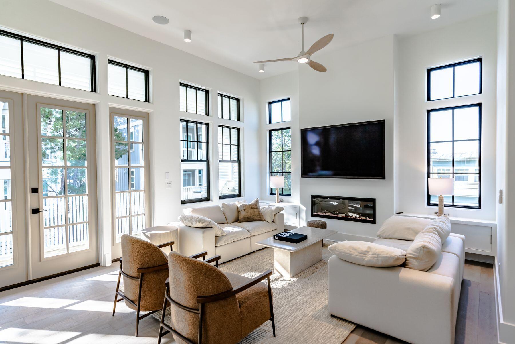 143 Grande Pointe Cir Inlet Beach Inlet Beach, FL 32461 - Photo 16 of 51 a living room with fireplace furniture and a flat screen tv