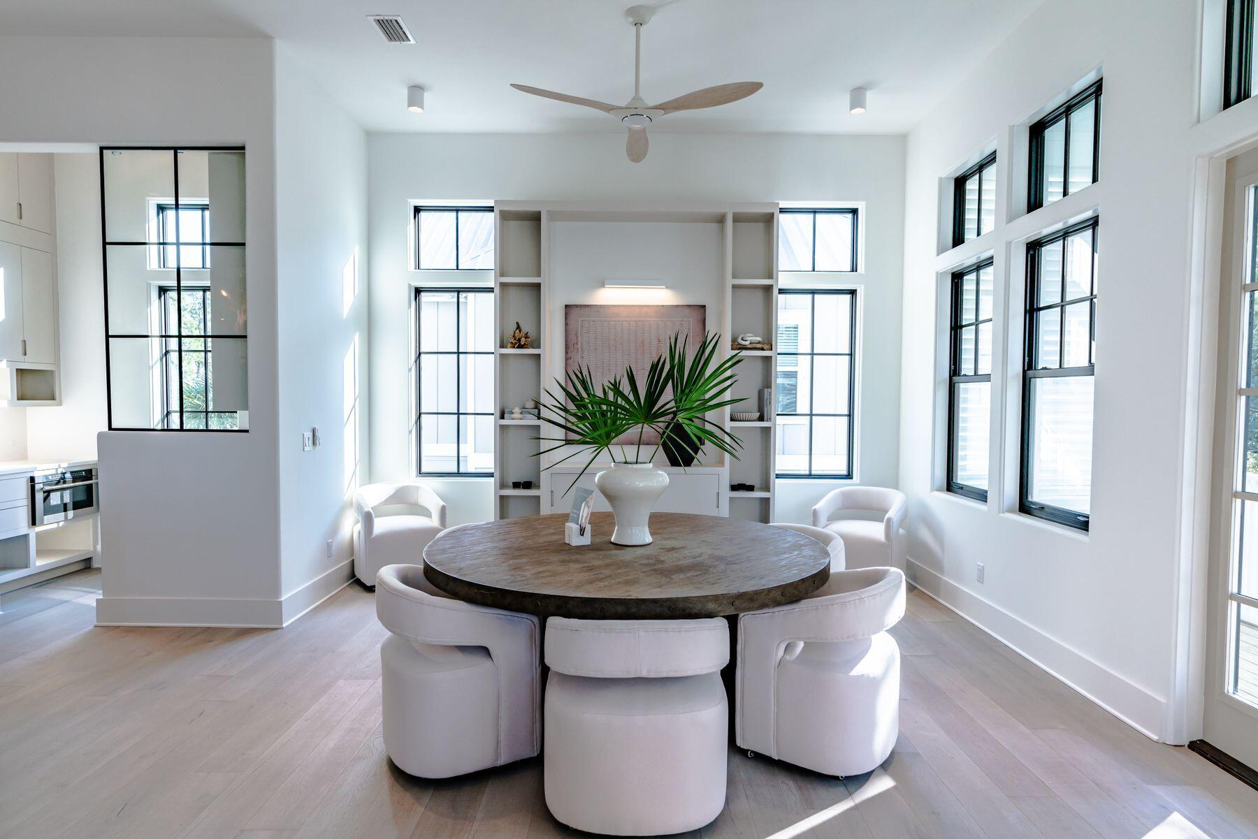 143 Grande Pointe Cir Inlet Beach Inlet Beach, FL 32461 - Photo 21 of 51 a dining room with table chairs and wooden floor