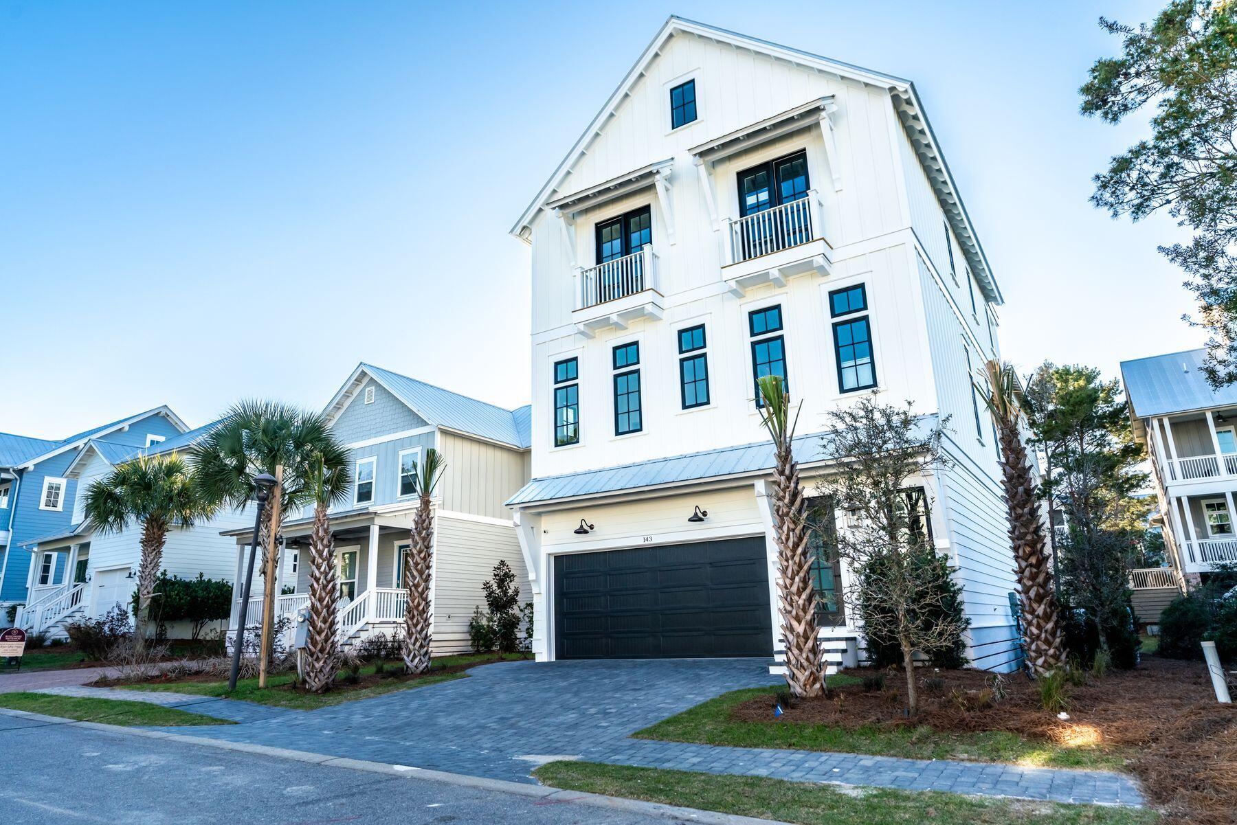 143 Grande Pointe Cir Inlet Beach Inlet Beach, FL 32461 - Photo 3 of 51 a front view of a house with a yard