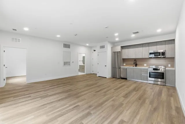 a view of kitchen with wooden floor