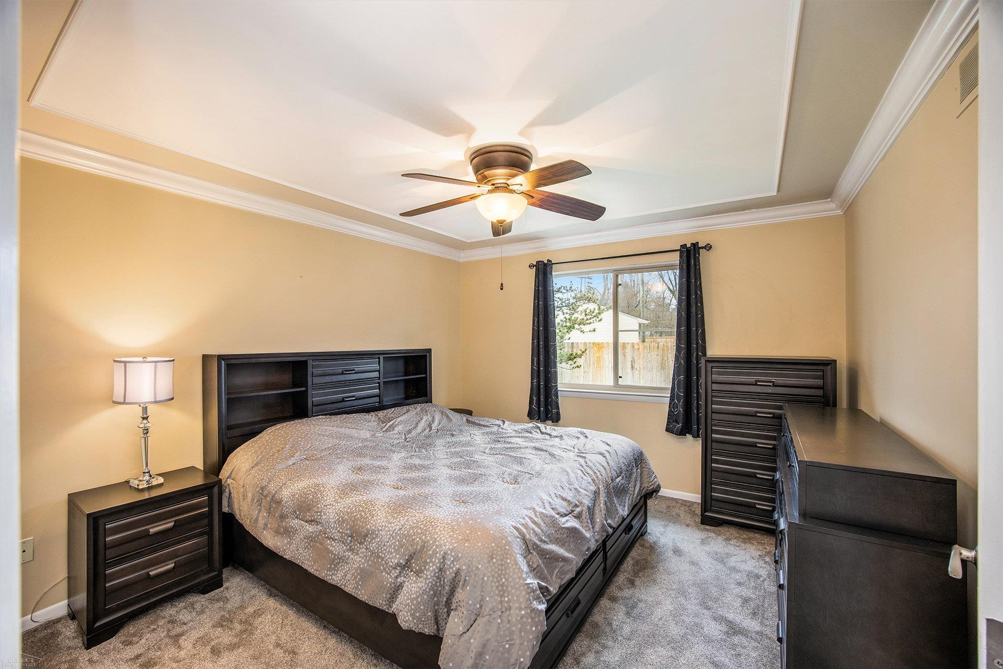 411 Ewell Street Romeo, MI 48065 - Photo 8 of 17 Primary bedroom with large closet and crown molding