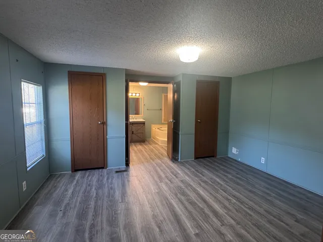 a view of a livingroom with wooden floor