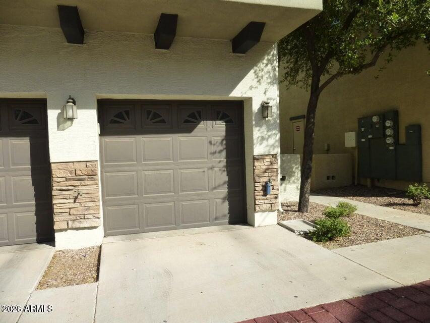 2727 North Price Road, Unit 28 Chandler, AZ 85224 - Photo 14 of 14 a front view of a house with a yard