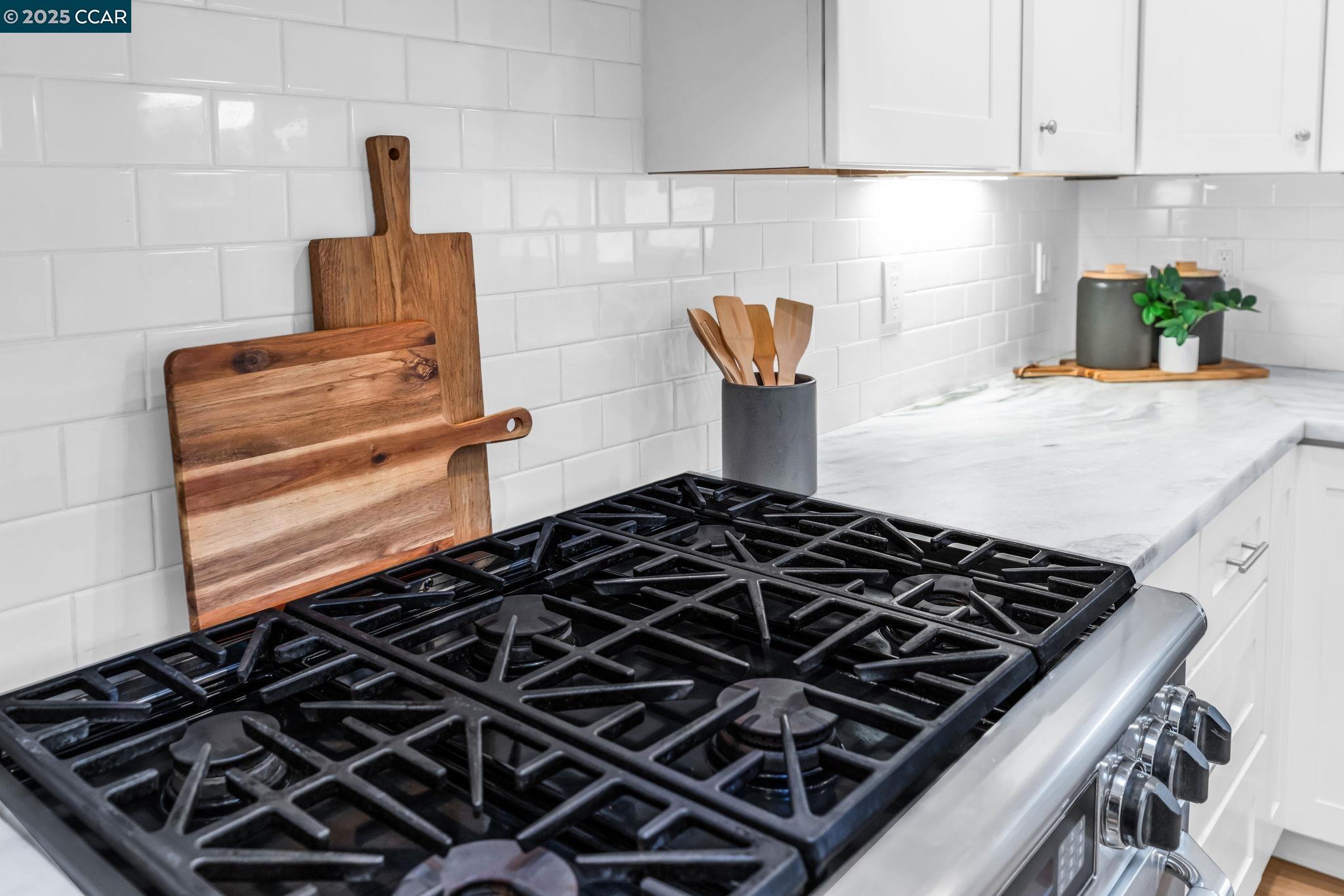 4597 Wildcat Lane Concord, CA 94521 - Photo 21 of 57 a kitchen with a stove and a cabinet