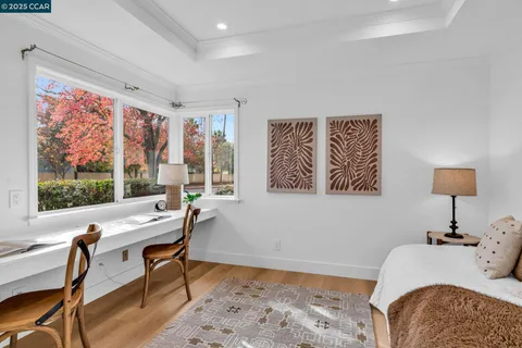 a table with a vase and a window