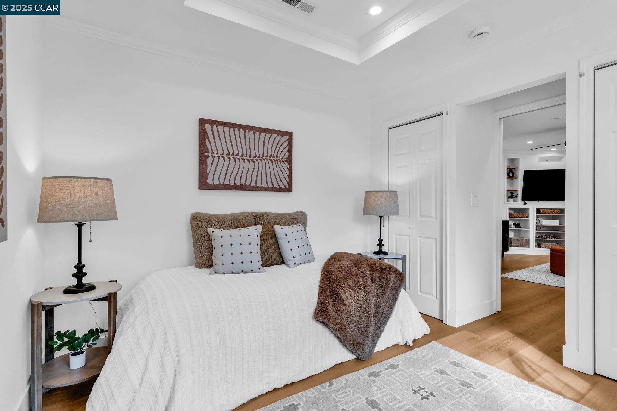 4597 Wildcat Lane Concord, CA 94521 - Photo 24 of 57 a bedroom with a bed and a lamp on table