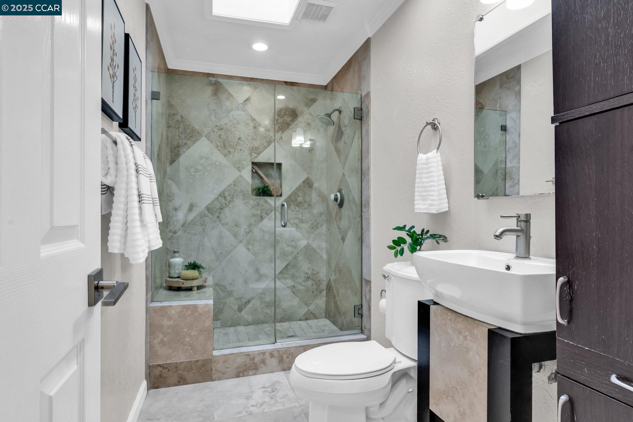 4597 Wildcat Lane Concord, CA 94521 - Photo 25 of 57 a bathroom with a sink toilet and shower