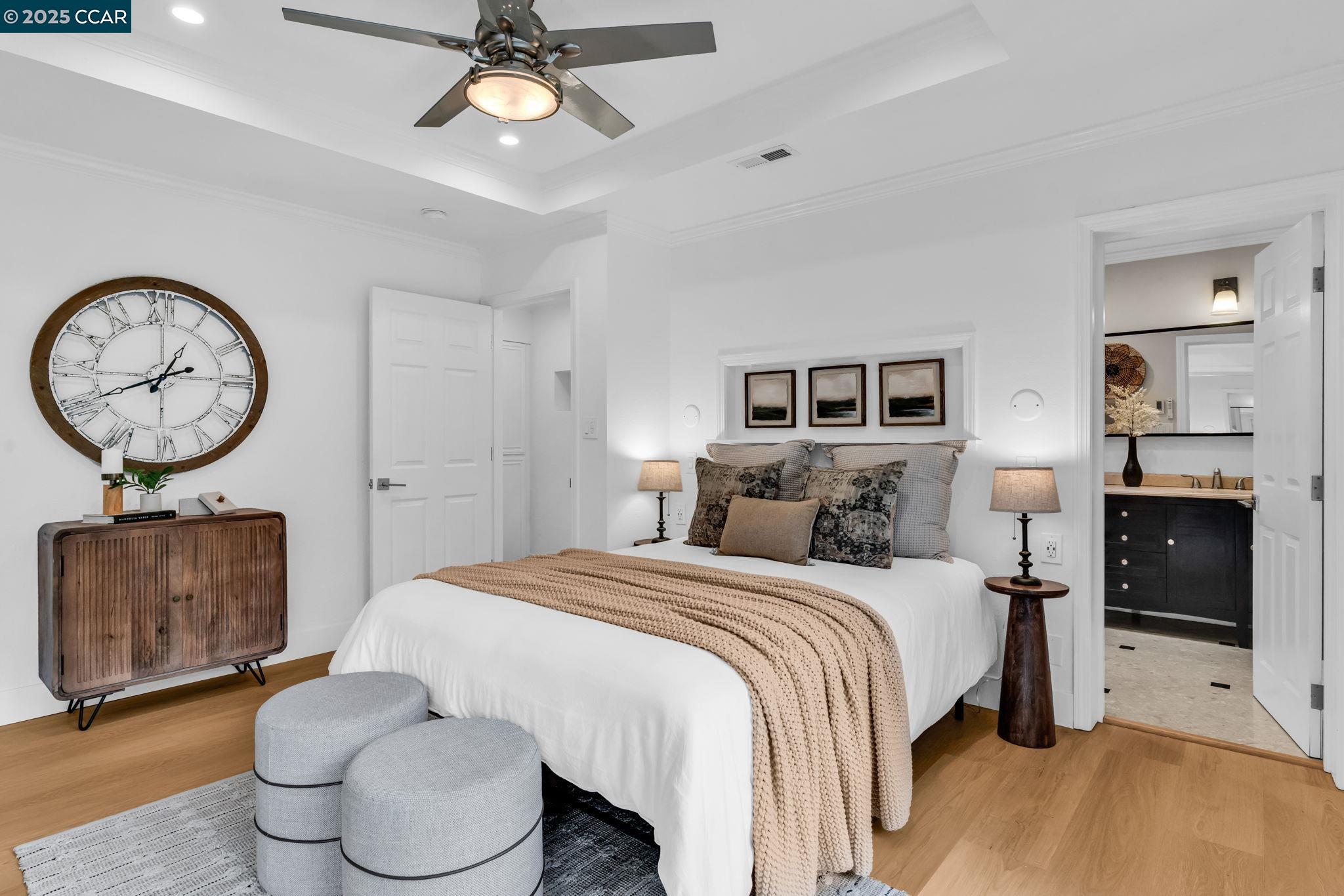 4597 Wildcat Lane Concord, CA 94521 - Photo 28 of 57 a bedroom with a bed and a chandelier