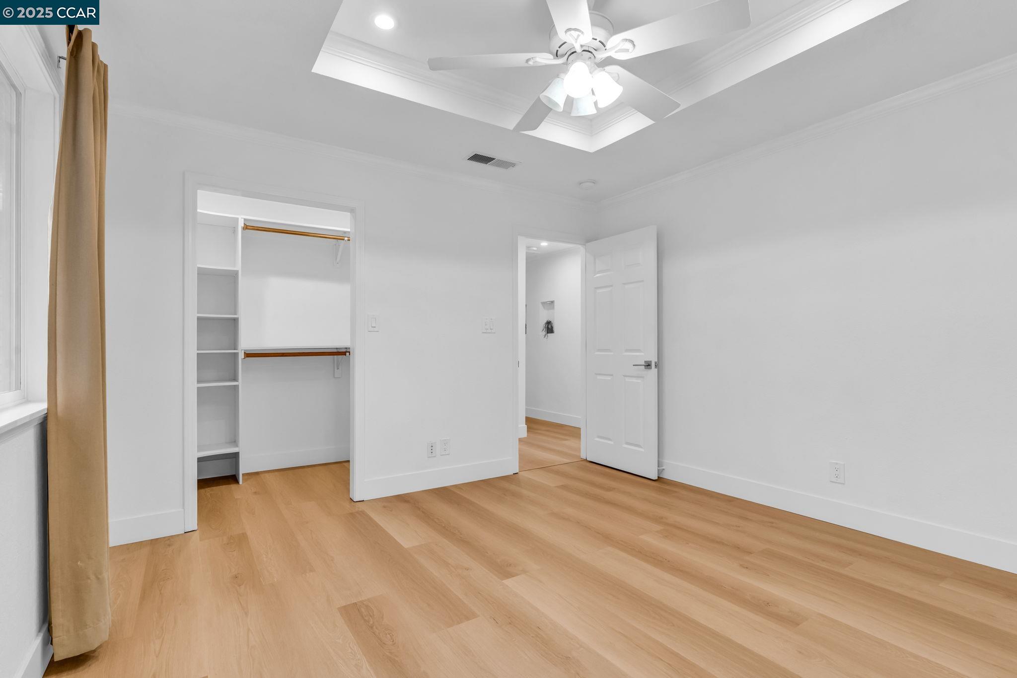 4597 Wildcat Lane Concord, CA 94521 - Photo 32 of 57 an empty room with a bathroom and a ceiling fan