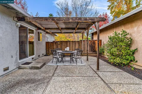 a view of an house with backyard space and garden