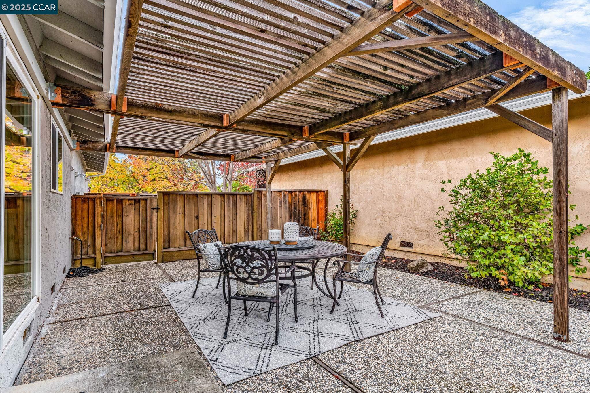4597 Wildcat Lane Concord, CA 94521 - Photo 35 of 57 a patio with table and chairs and potted plants