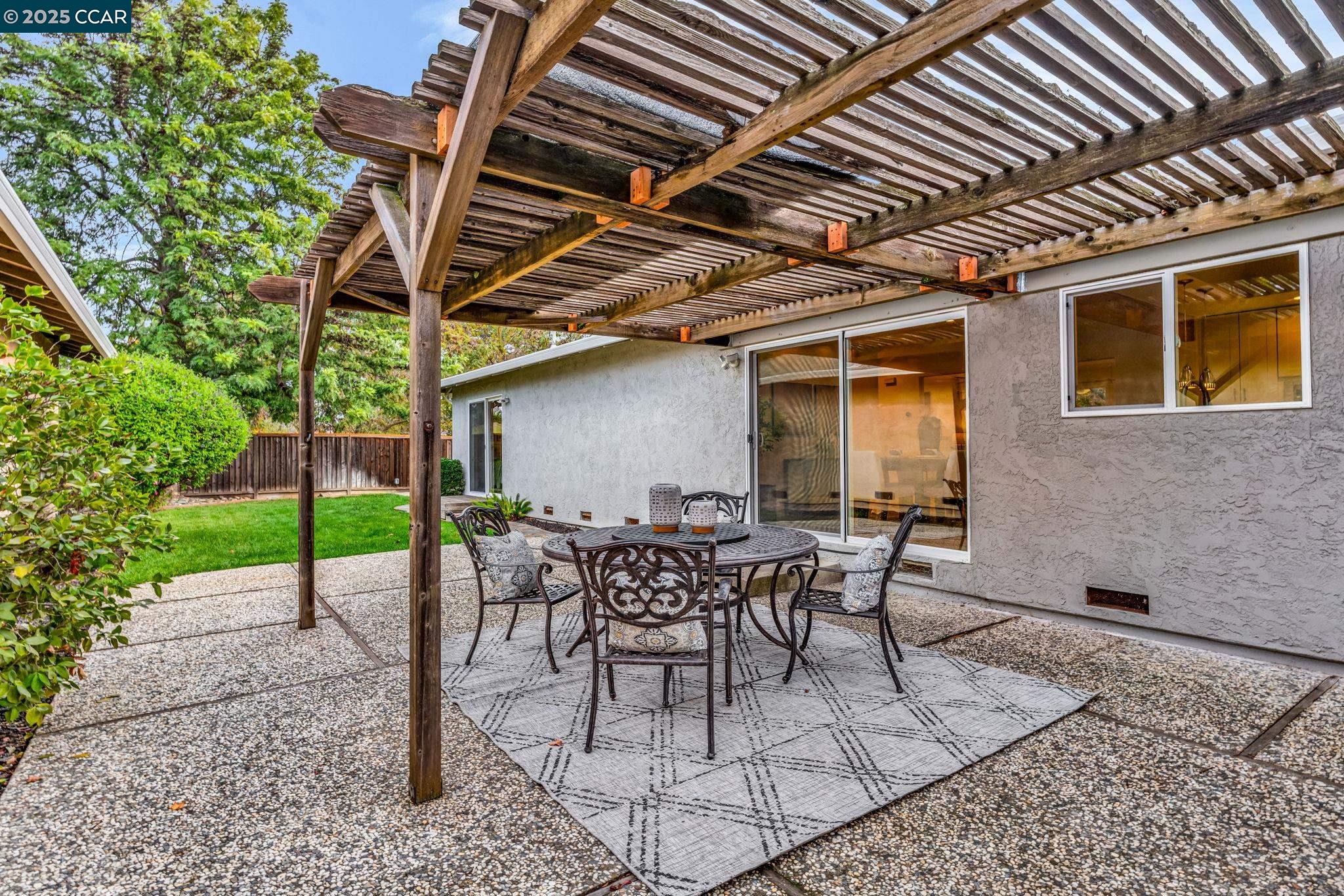 4597 Wildcat Lane Concord, CA 94521 - Photo 36 of 57 a patio with table and chairs