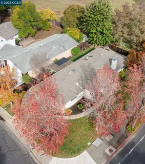 an aerial view of residential houses with outdoor space