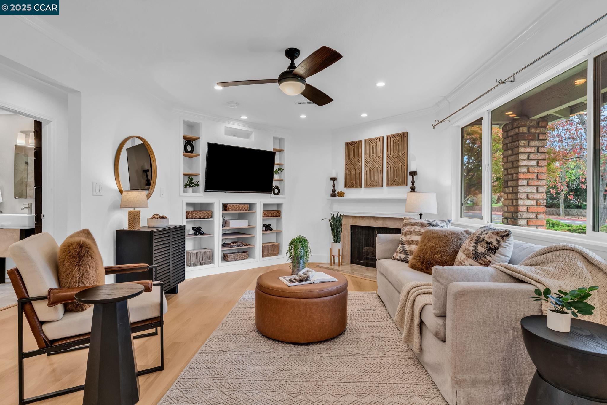 4597 Wildcat Lane Concord, CA 94521 - Photo 5 of 57 a living room with fireplace furniture and a flat screen tv