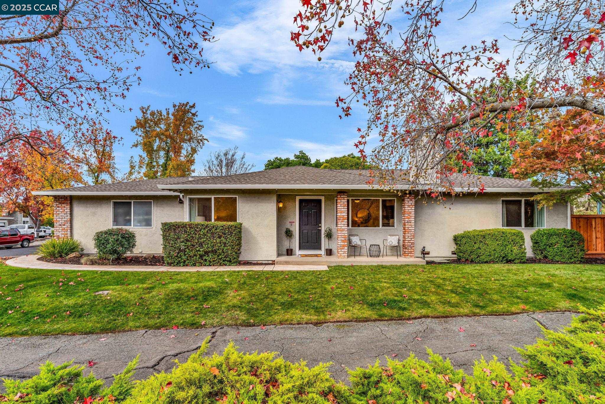 4597 Wildcat Lane Concord, CA 94521 - Photo 55 of 57 a front view of a house with a garden and yard