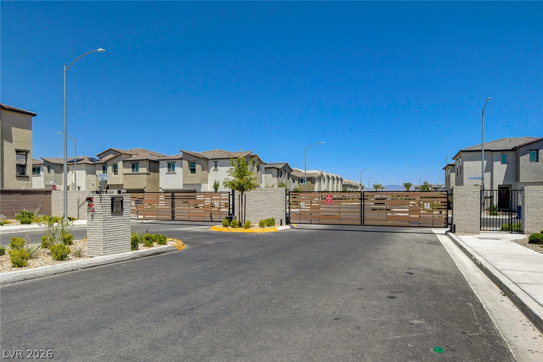 6924 Spicy Merlot Street North Las Vegas, NV 89086 - Photo 65 of 83 Secure community entrance with stylish gates, offering peace of mind and regulated access.