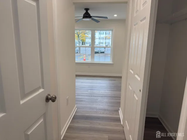 a view of a hallway with windows