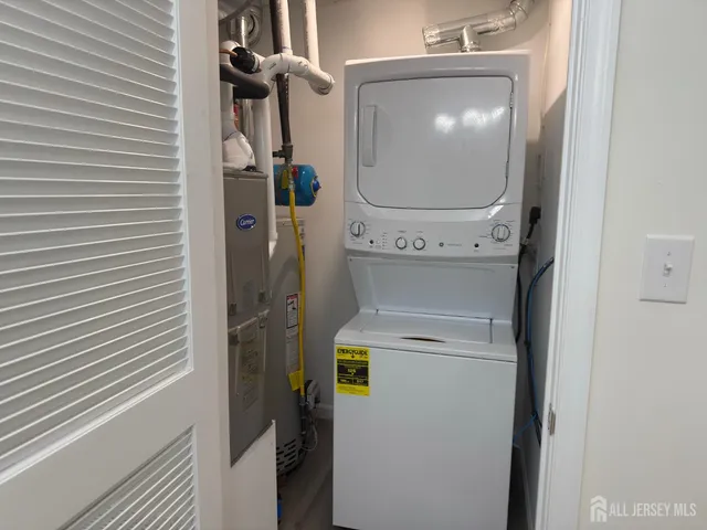 a close view of a utility room with dryer and washer